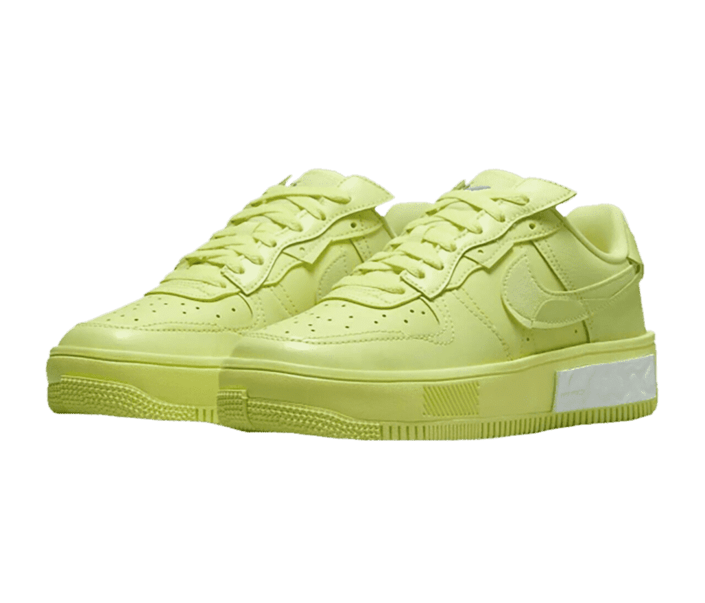 A pair AF1 “Fontanka” Low sneakers in lime green with blocky overlays and dotted rubber outsoles that are misaligned at the toe.