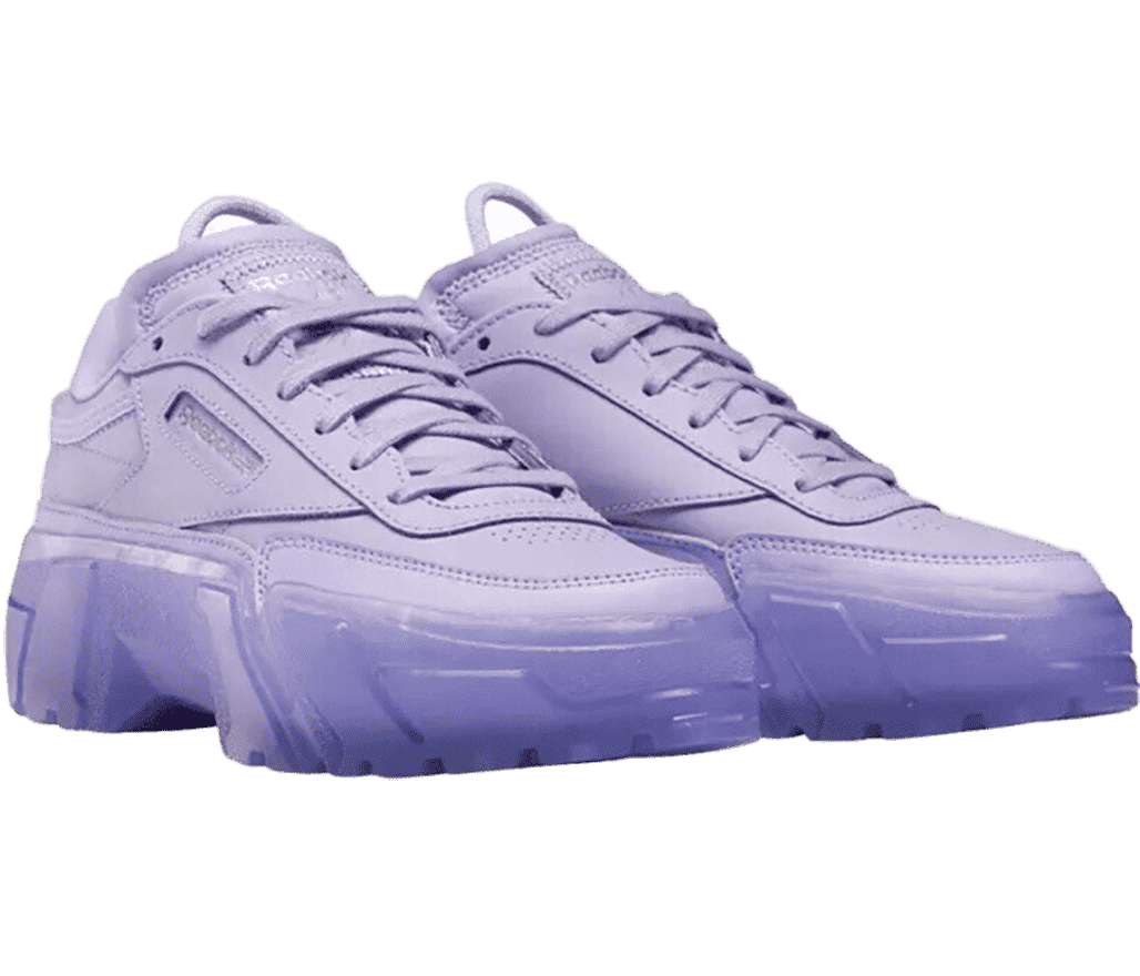 A pair of Reebok x Cardi B “Crisp Purple” sneakers in purple leather, a cotton tongue pull-loop, and semi-translucent rubber soles.