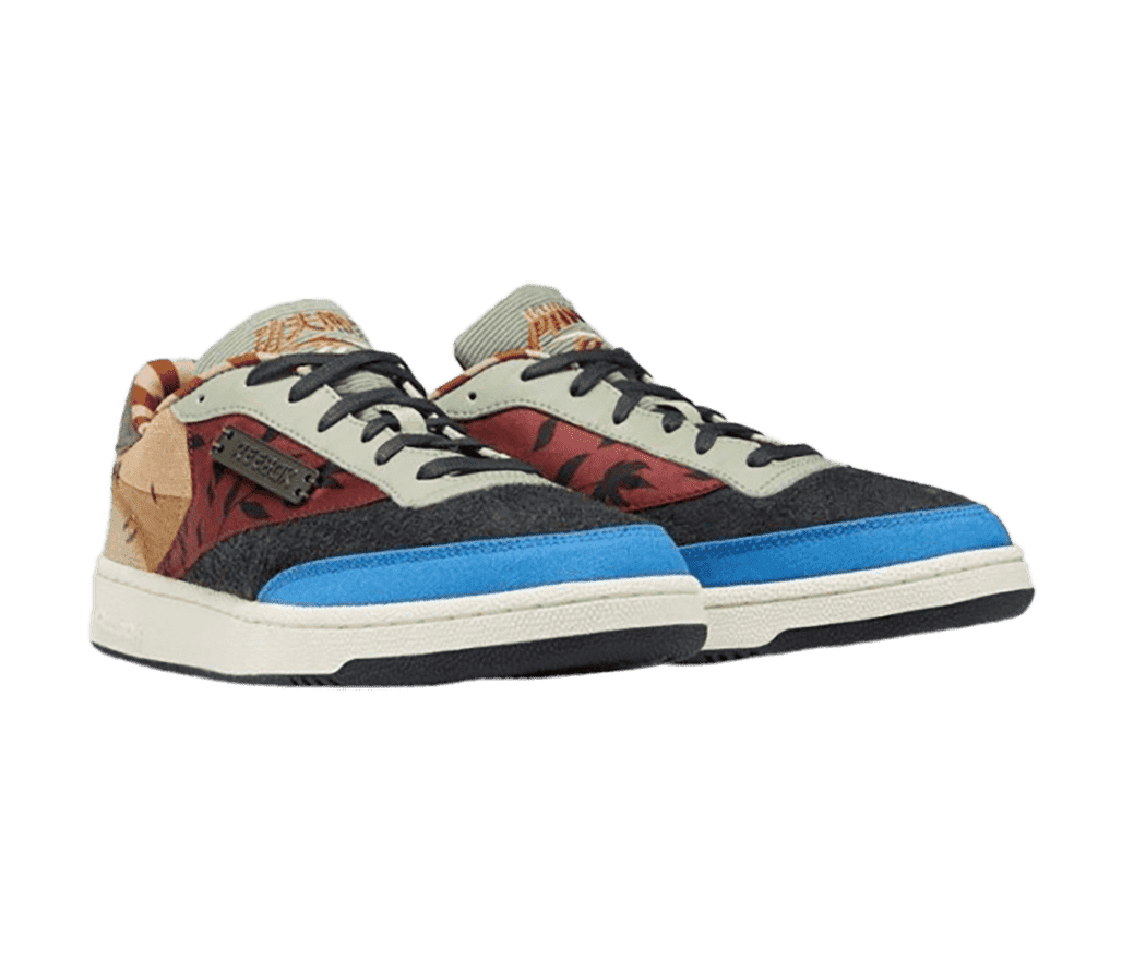 A pair of Reebok x Kung Fu Panda “Patchwork” sneakers in red, charcoal, light blue, and beige felt and leaf graphics in the mid section.