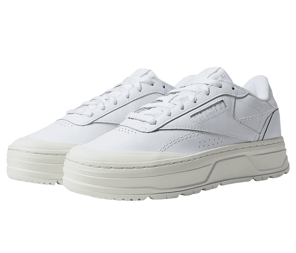 A pair of white Reebok Club C Double Geo sneakers with an off-white platform sole.