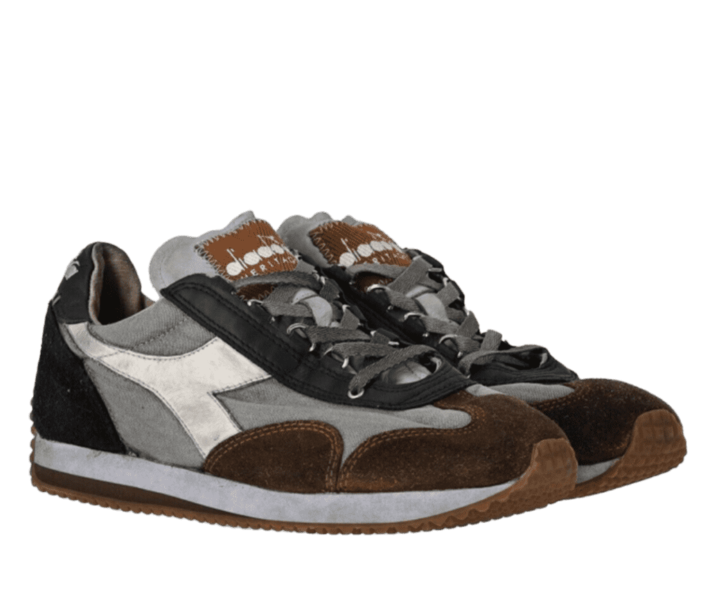 A pair of Diadora running shoes. They have a black upper and heel, gray sides, and a brown and gray sole.The tongue of the shoes are gray with a brown Diadora logo at the top.