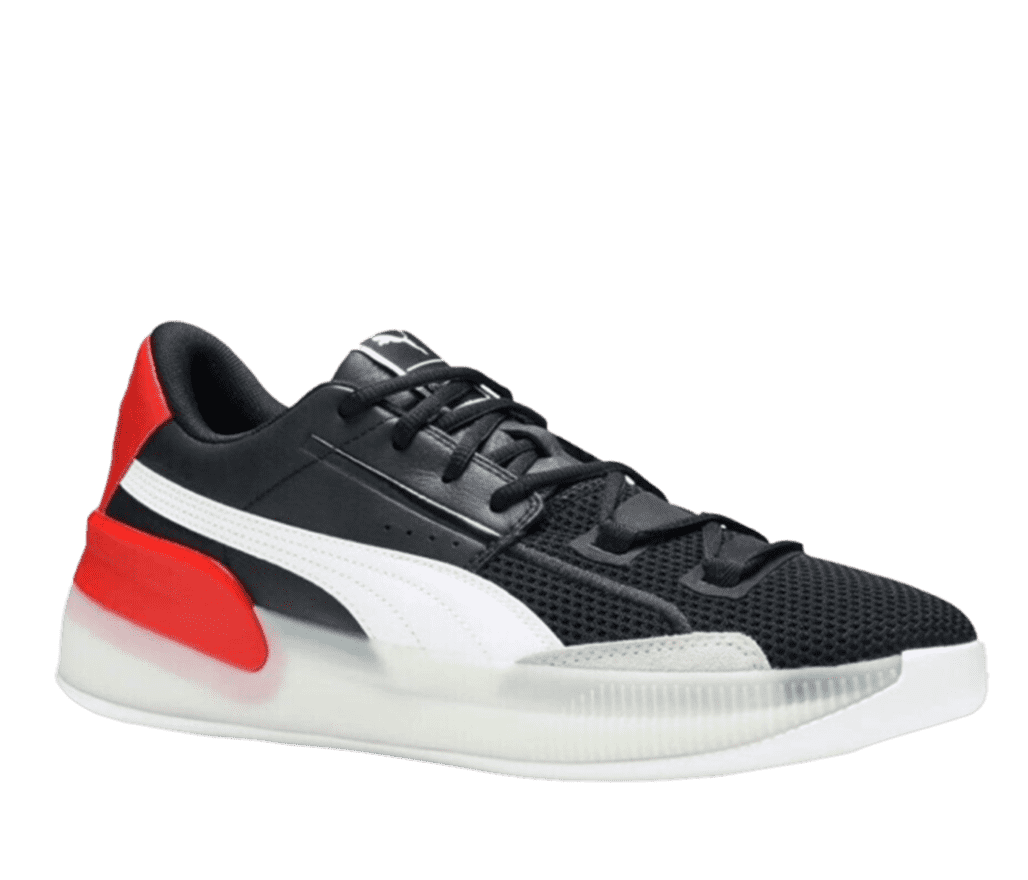 A side shot of a black Puma Clyde sneaker. The sides feature a white stripe that increases in width as it gets closer to the front of the shoe, and red back and heel. The sole is white and semi-translucent.