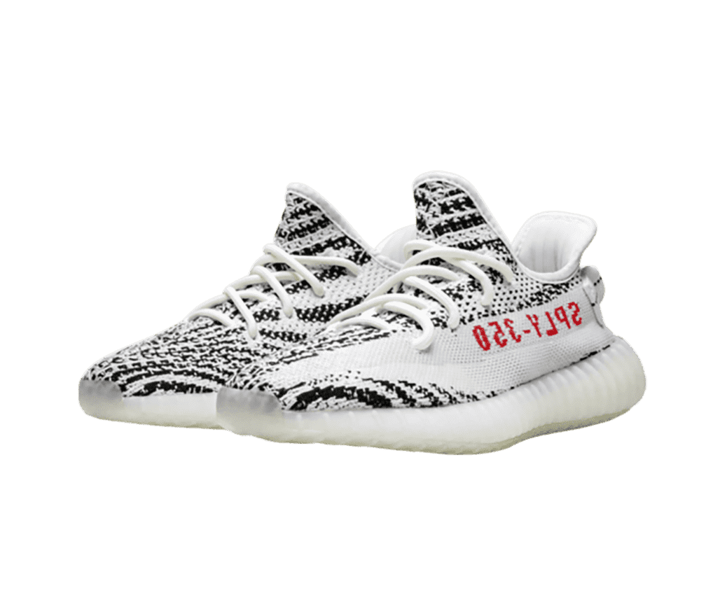 A white pair of Adidas Yeezy sneakers covered in black pixelated spiral patterns. The soles are translucent and “SPLY-350” is written backwards in red, on the lateral sides.