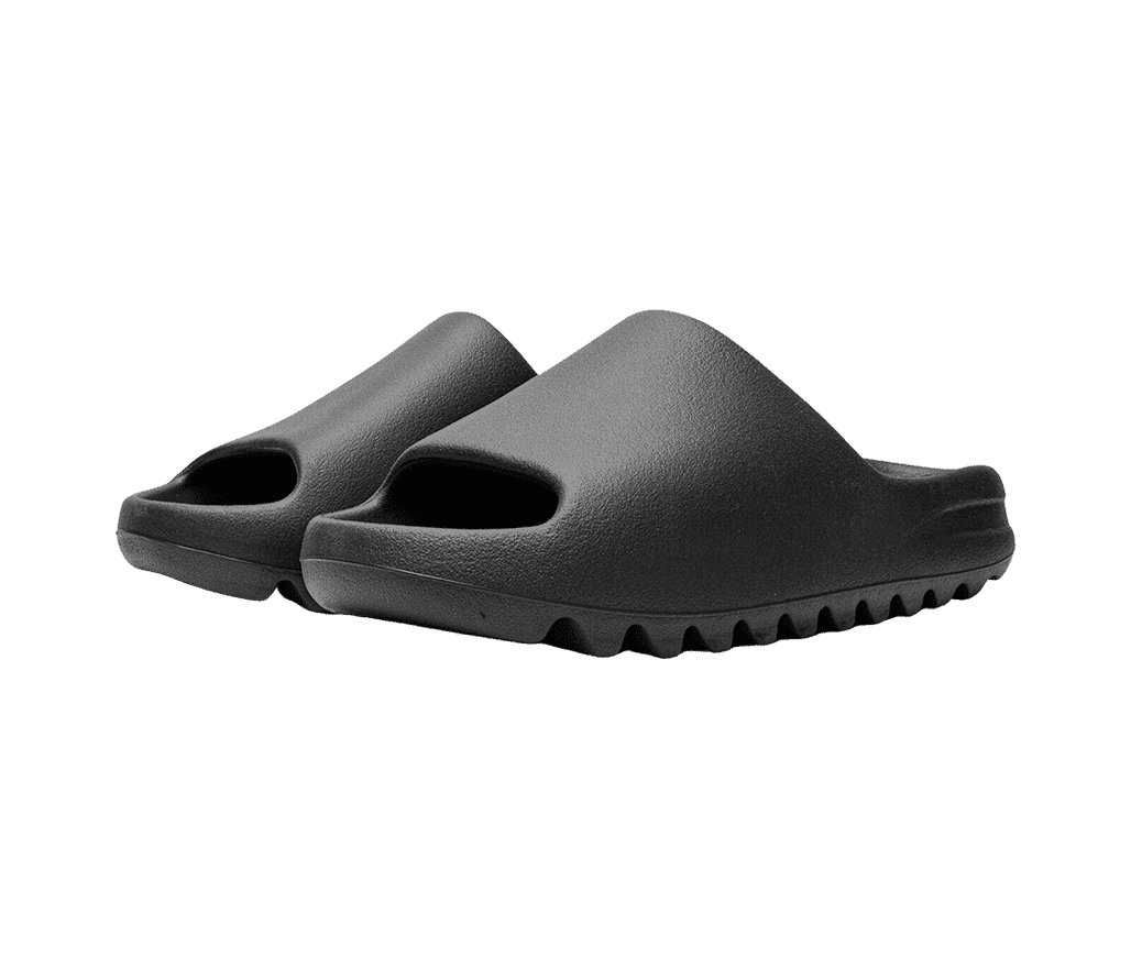 A pair of black Adidas Yeezy “Pure” slides with zig-zagged soles.
